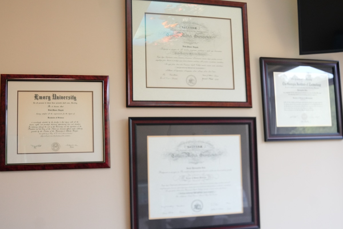 Framed degrees and credentials from Emory University displayed at iCare Orthodontics in Norcross, GA